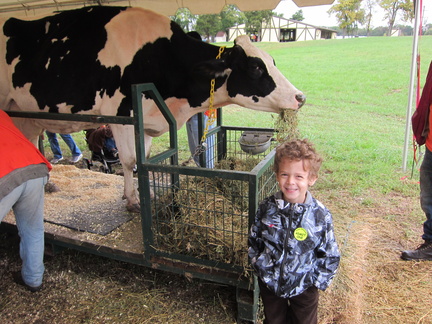 poses-with-a-cow-then-milks-it 6209175147 o